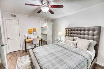 Modern bedroom with tufted headboard and work desk